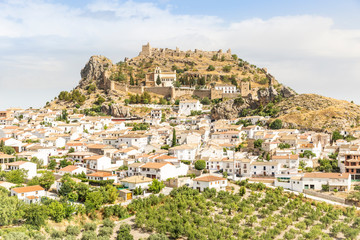 Fototapeta premium panoramic view of Moclin town and the castle, province of Granada, Andalusia, Spain
