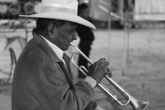 Senior Man Playing Trumpet Outdoors