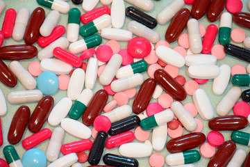 Different colorful many pills and capsules in abstract style. Healthy background. Health care,...