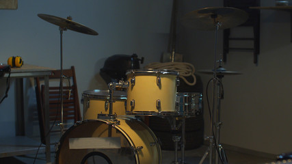 Fototapeta na wymiar Musical instruments. Guitar and drums. View