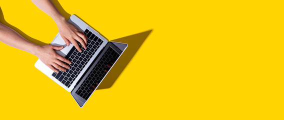 Person using a laptop computer from above