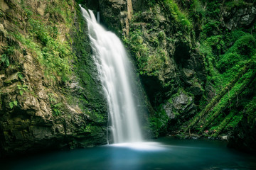 Long exposure photograph of mountain waterfall. Landscape of Miedzygorze, Sudety, Poland.