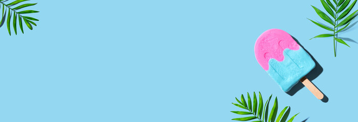 Popsicle with tropical plants - overhead view flat lay