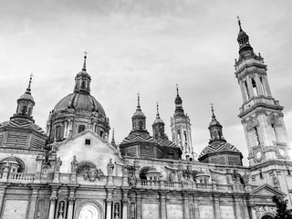Fototapeta na wymiar The Cathedral-Basilica of Our Lady of the Pillar, a Roman Catholic church in the city of Zaragoza, in Aragon, Spain. Black and white.