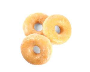 Delicious donuts on white background, top view