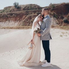 Bride and Groom at wedding Day walking Outdoors on spring nature. Bridal couple,  Loving wedding...