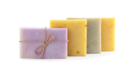 Different bars of organic handmade soap isolated on white