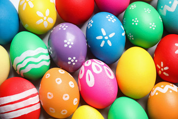 Fototapeta na wymiar Colorful Easter eggs with different patterns as background, top view