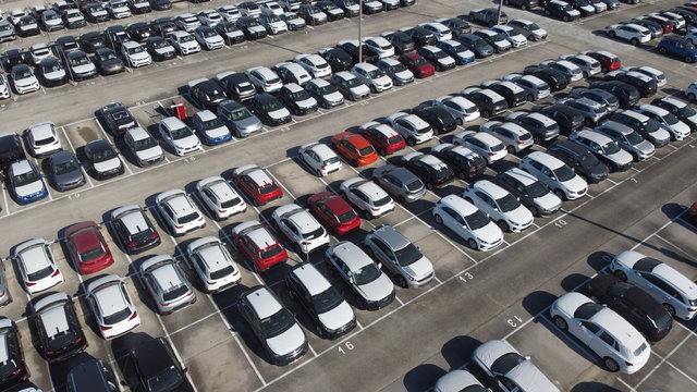 LOGISTIC AND TRADE AUTOMOBILE CENTER. DRONE AERIAL PHOTO. VEHICLE PARK