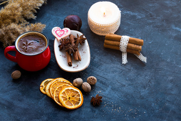 Fototapeta na wymiar mixed natural spices with a cup of coffee and orange peels