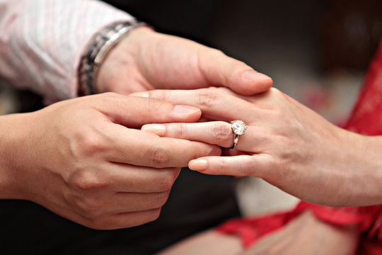 Man giving an engagement ring to his girlfriend 