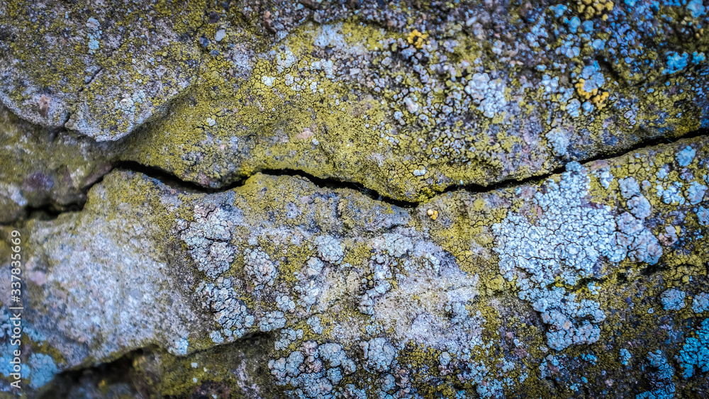 Poster old stone wall with a crack. texture for design