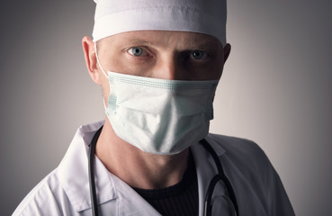 Face of the doctor in a mask. Close-up. Medical professional preventive gear