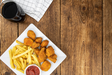 Homemade Chicken Nuggets on vintage background