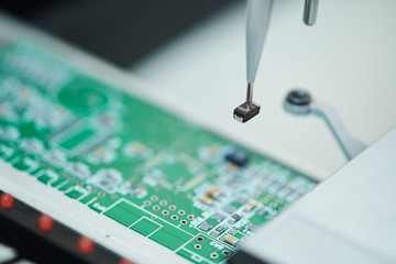 microchip semiconductor manufacturing. automatic machine robot installing chip on board.