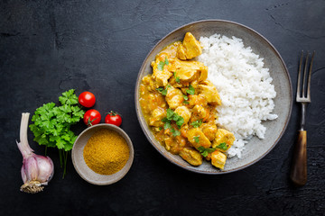 Spicy chicken cooked with curry sauce and rice, top view