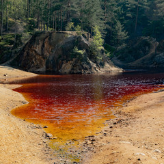 Purple lake, artifical pond in place of former pyrite mine. Poland, Lower Silesia.