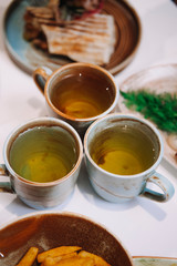 three cups of tea on the table