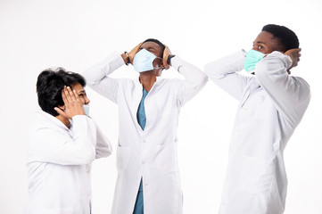 A consultation of doctors who discuss the diagnosis. Doctors on a white background.