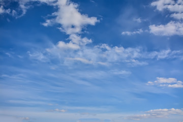 Naklejka na ściany i meble Light white clouds in the blue sky.