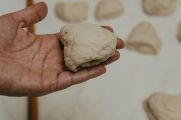 Muslim woman in isolation making bread for meal during holy month Ramadan