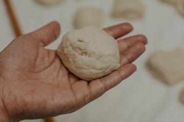 Muslim woman in isolation making bread for meal during holy month Ramadan