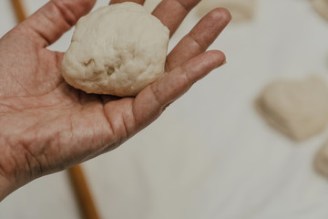 Muslim woman in isolation making bread for meal during holy month Ramadan
