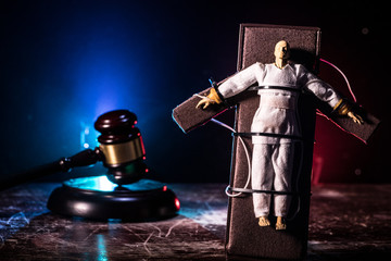 Prisoner handcuffed to death by lethal injection, vial with sodium thiopental and syringe on top of...