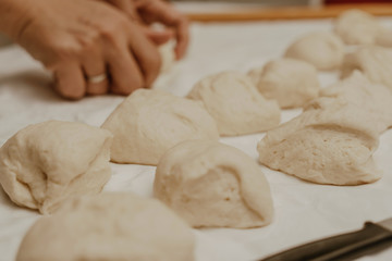 Muslim woman in isolation making bread for meal during holy month Ramadan
