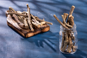 Dried stems of medicinal valerian in the glass jar - Valeriana officinalis