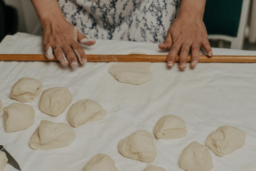 Muslim woman in isolation making bread for meal during holy month Ramadan