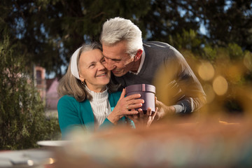 Happy mature man kissing his wife