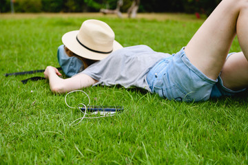 Smartphone with power bank and sleeping woman