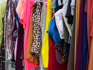 Women's clothes hanging in a wardrobe