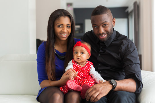 Portrait Of A Young African American  Couple With Her Baby Girl