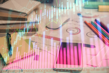 Double exposure of forex chart drawing and cell phone background. Concept of financial data analysis