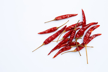Dry red hot chili peppers on white background.