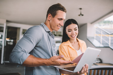 Positive diverse colleagues solving working problem together