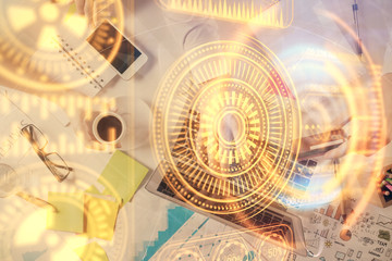 Double exposure of man's hands typing over computer keyboard and tech theme hologram drawing. Top view. Technology concept.