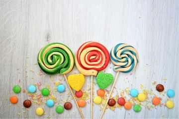 colorful lollipop on a wooden background