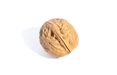 Ripe whole walnut, isolated on white background