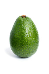 Green avocado closeup on a white background