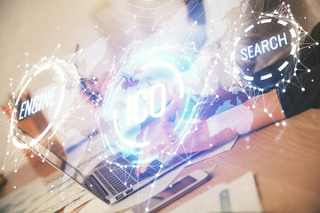 Double exposure of woman hands typing on computer and crypto market theme hologram drawing. Blockchain concept.