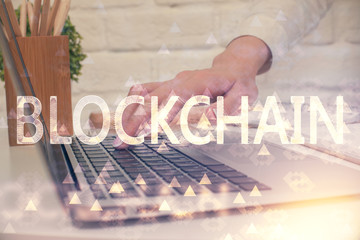 Double exposure of woman hands typing on computer and crypto market theme hologram drawing....
