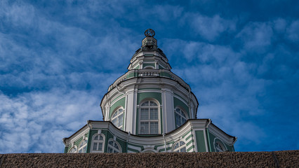 Fototapeta na wymiar The upper tiers of the Kunstkamera tower in St. Petersburg against the blue sky