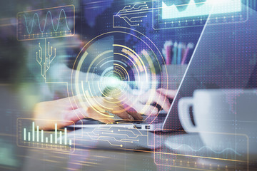 Double exposure of woman hands working on computer and data theme hologram drawing. Tech concept.