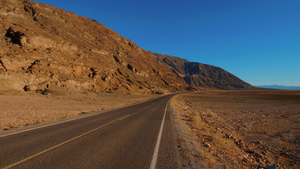 Fototapeta na wymiar Scenery road through the amazing landscape of Death Valley National Park California - USA 2017