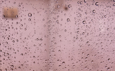 Droplets on glass in a rainy weather