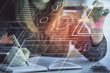 Double exposure of woman on-line shopping holding a credit card and data theme hologram drawing....
