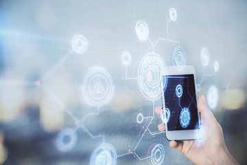 Double exposure of technology sketch hologram and woman holding and using a mobile device.